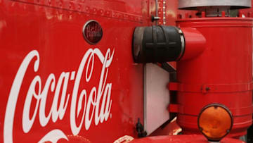 BRUSSELS, BELGIUM - DECEMBER 09: The Coca Cola logo is seen on trucks on December 9, 2006 in Brussels, Belgium. It is 75 years since Haddon Sundblom drew the Coca Cola Christmas man, and to celebrate Coca Cola Belgium has developed an aluminium bottle which the trucks will deliver exclusively throughout Luxembourg and Belgium. (Photo by Mark Renders/Getty Images)