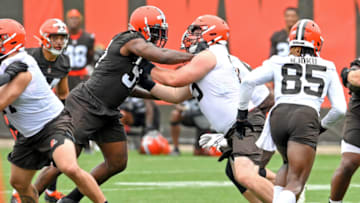 BEREA, OH - JULY 29: Defensive tackle Malik Jackson #97 of the Cleveland Browns rushes against offensive guard Joel Bitonio #75 during the second day of Cleveland Browns Training Camp on July 29, 2021 in Berea, Ohio. (Photo by Nick Cammett/Getty Images)