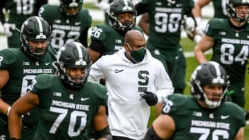 Michigan State's head coach Mel Tucker and the Spartans take the filed before the game against Ohio State on Saturday, Dec. 5, 2020, at Spartan Stadium in East Lansing.201205 Msu Osu 030a