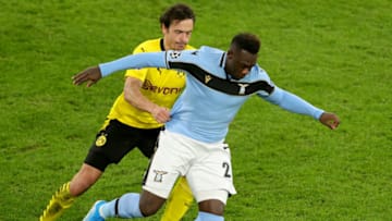 DORTMUND, GERMANY - DECEMBER 02: Felipe Caicedo of Lazio looks to break past Thomas Delaney of Borussia Dortmund during the UEFA Champions League Group F stage match between Borussia Dortmund and SS Lazio at Signal Iduna Park on December 02, 2020 in Dortmund, Germany. Sporting stadiums around Germany remain under strict restrictions due to the Coronavirus Pandemic as Government social distancing laws prohibit fans inside venues resulting in games being played behind closed doors. (Photo by Friedemann Vogel - Pool/Getty Images)