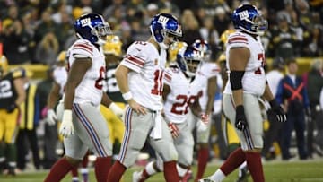 Oct 9, 2016; Green Bay, WI, USA; New York Giants quarterback Eli Manning (10) walks back to the bench after an incomplete pass in the fourth quarter during the game against the Green Bay Packers at Lambeau Field. Mandatory Credit: Benny Sieu-USA TODAY Sports
