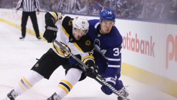 TORONTO, ON- APRIL 19 - Boston Bruins left wing Brad Marchand (63) and Toronto Maple Leafs center Auston Matthews (34) chase a puck as the Toronto Maple Leafs lose game 4 to the Boston Bruins 3-1 their first round NHL Stanley Cup playoff series at the Air Canada Centre in Toronto. April 19, 2018. (Steve Russell/Toronto Star via Getty Images)