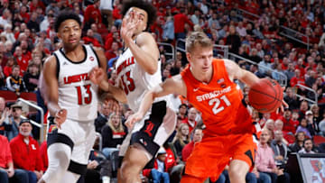 LOUISVILLE, KY - FEBRUARY 19: Marek Dolezaj #21 of the Syracuse Orange fights for a rebound against Jordan Nwora #33 and David Johnson #13 of the Louisville Cardinals in the first half of a game at KFC YUM! Center on February 19, 2020 in Louisville, Kentucky. Louisville defeated Syracuse 90-66. (Photo by Joe Robbins/Getty Images)
