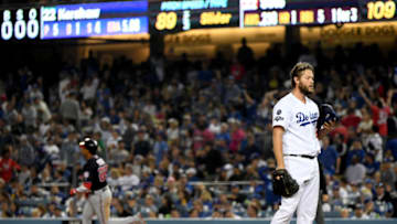 LOS ANGELES, CALIFORNIA - OCTOBER 09: Clayton Kershaw #22 of the Los Angeles Dodgers reacts after giving up a solo home run to Juan Soto #22 of the Washington Nationals in the eighth inning of game five of the National League Division Series against the Washington Nationals at Dodger Stadium on October 09, 2019 in Los Angeles, California. (Photo by Harry How/Getty Images)