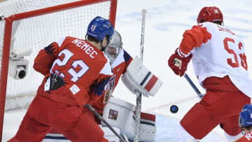 Russia's Alexei Marchenko (R) tries to score as Czech Republic's Pavel Francouz blocks it in the men's semi-final ice hockey match between the Czech Republic and the Olympic Athletes from Russia during the Pyeongchang 2018 Winter Olympic Games at the Gangneung Hockey Centre in Gangneung on February 23, 2018. / AFP PHOTO / JUNG Yeon-Je (Photo credit should read JUNG YEON-JE/AFP via Getty Images)