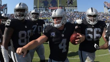 Sep 25, 2016; Nashville, TN, USA; Oakland Raiders players Clive Walford (88), Kelechi Osemele (70), Derek Carr (4), Gabe Jackson (66) and Latavius Murray (28) celebrate after defeating the Tennessee Titans 17-10 at Nissan Stadium. Mandatory Credit: Kirby Lee-USA TODAY Sports