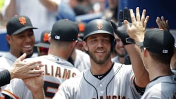 Jun 2, 2016; Atlanta, GA, USA; San Francisco Giants starting pitcher Madison Bumgarner (40) celebrates his two-run home run with teammates in the dugout in the 5th inning of their game against the Atlanta Braves at Turner Field. Mandatory Credit: Jason Getz-USA TODAY Sports