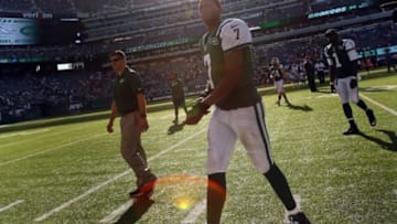 Sep 28, 2014; East Rutherford, NJ, USA; New York Jets quarterback Geno Smith (7) walks off the field after the game against the Detroit Lions at MetLife Stadium. The Lions won 24-17. Mandatory Credit: Adam Hunger-USA TODAY Sports