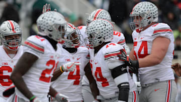 EAST LANSING, MI - NOVEMBER 19: Buckeyes running back Curtis Samuel (4) celebrates with teammates following his first quarter touchdown during a Big Ten Conference NCAA football game between Michigan State and Ohio State on November 19, 2016, at Spartan Stadium in East Lansing, MI. Ohio State defeated Michigan State 17-16. (Photo by Adam Ruff/Icon Sportswire via Getty Images)