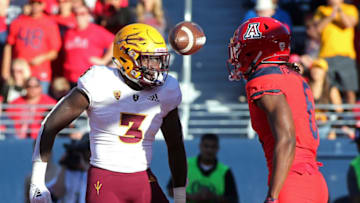 TUCSON, AZ - NOVEMBER 24: Running back Eno Benjamin #3 of the Arizona State Sun Devils exchanges words with defensive back Demetrius Flannigan-Fowles #6 of the Arizona Wildcats after scoring a touchdown during the second half of the college football game at Arizona Stadium on November 24, 2018 in Tucson, Arizona. (Photo by Ralph Freso/Getty Images)
