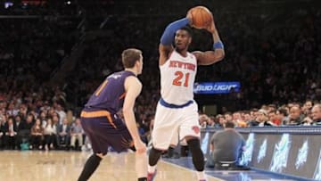 Jan 13, 2014; New York, NY, USA; New York Knicks shooting guard Iman Shumpert (21) controls the ball against Phoenix Suns shooting guard Goran Dragic (1) during the third quarter of a game at Madison Square Garden. The Knicks defeated the Suns 98-96 in overtime. Mandatory Credit: Brad Penner-USA TODAY Sports