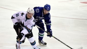 Sep 21, 2015; Victoria, British Columbia, CAN; San Jose Sharks forward Bryan Lerg (11) skates against Vancouver Canucks forward Nicklas Jensen (46) during the third period at Q Centre. The Vancouver Canucks won 1-0 in overtime. Mandatory Credit: Anne-Marie Sorvin-USA TODAY Sports