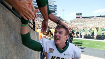 IOWA CITY, IOWA- SEPTEMBER 17: Quarterback Easton Stick #12 of the North Dakota State Bisons celebrates with fans after the upset over the Iowa Hawkeyes on September 17, 2016 at Kinnick Stadium in Iowa City, Iowa. (Photo by Matthew Holst/Getty Images)