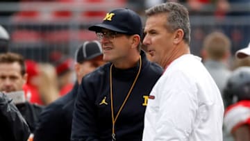 COLUMBUS, OH - NOVEMBER 26: (R-L) Head coach Urban Meyer of the Ohio State Buckeyes and Head coach Jim Harbaugh of the Michigan Wolverines (Photo by Gregory Shamus/Getty Images)