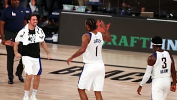 Aug 1, 2020; Lake Buena Vista, Florida, USA; Indiana Pacers forward T.J. Warren (1) celebrates with teammates after making a three pointer during the fourth quarter of a NBA basketball game against the Philadelphia 76ers at Visa Athletic Center. Mandatory Credit: Kim Klement-USA TODAY Sports