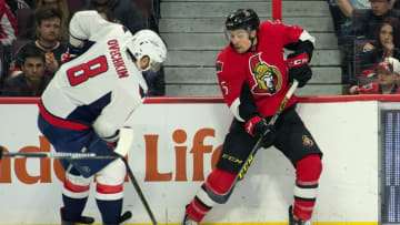 Mar 22, 2016; Ottawa, Ontario, CAN; Washington Capitals left wing Alex Ovechkin (8) battles with Ottawa Senators defenseman Cody Ceci (5) in the second period at the Canadian Tire Centre. Mandatory Credit: Marc DesRosiers-USA TODAY Sports