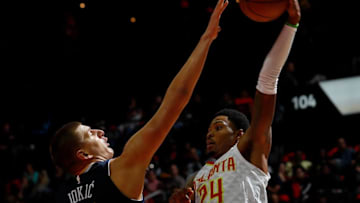 ATLANTA, GA - OCTOBER 27: Kent Bazemore #24 of the Atlanta Hawks looks to pass against Nikola Jokic #15 of the Denver Nuggets at Philips Arena on October 27, 2017 in Atlanta, Georgia. NOTE TO USER: User expressly acknowledges and agrees that, by downloading and or using this photograph, User is consenting to the terms and conditions of the Getty Images License Agreement. (Photo by Kevin C. Cox/Getty Images)