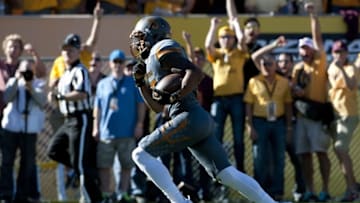 Nov 21, 2015; Tempe, AZ, USA; Arizona State Sun Devils wide receiver Devin Lucien (15) runs the ball for a touchdown against the Arizona Wildcats during the first quarter of the territorial cup at Sun Devil Stadium. Mandatory Credit: Casey Sapio-USA TODAY Sports