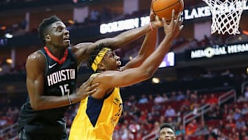 HOUSTON, TX - NOVEMBER 29: Clint Capela #15 of the Houston Rockets reaches over Myles Turner #33 of the Indiana Pacers for a loose ball in the first quarter at Toyota Center on November 29, 2017 in Houston, Texas. NOTE TO USER: User expressly acknowledges and agrees that, by downloading and or using this photograph, User is consenting to the terms and conditions of the Getty Images License Agreement. (Photo by Bob Levey/Getty Images)