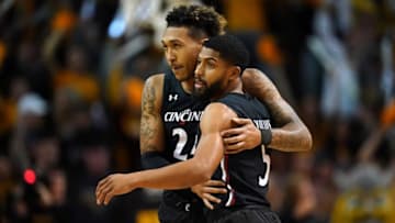 Cincinnati Bearcats guards David DeJulius and Jeremiah Davenport embrace during game against Northern Kentucky. The Enquirer.