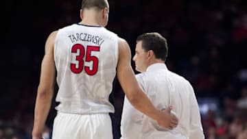 Feb 14, 2016; Tucson, AZ, USA; Arizona Wildcats head coach Sean Miller and center Kaleb Tarczewski (35) talk during the second half against the Southern California Trojans at McKale Center. Arizona won 86-78. Mandatory Credit: Casey Sapio-USA TODAY Sports