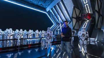 LAKE BUENA VISTA, FL - APRIL 5: In this handout photo provided by Walt Disney Resorts, NFL superstar Tom Brady visits Star Wars: Galaxy's Edge inside Disney's Hollywood Studios at Walt Disney World Resort on April 5, 2021 in Lake Buena Vista, Florida. Brady spent time in a galaxy far, far away to celebrate the Tampa Bay Buccaneers victory in Super Bowl LV this past February, where the star quarterback was named MVP. (Photo by Matt Stroshane/Walt Disney World Resorts via Getty Images)