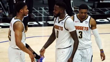 Denver Nuggets forward JaMychal Green reacts with guard PJ Dozier and guard Shaquille Harrison after scoring a basket on 1 May 2021. (Gary A. Vasquez-USA TODAY Sports)