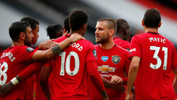 MANCHESTER, ENGLAND - JULY 04: Marcus Rashford of Manchester United celebrates with teammates after scoring his team's second goal from the penalty spot during the Premier League match between Manchester United and AFC Bournemouth at Old Trafford on July 04, 2020 in Manchester, England. Football Stadiums around Europe remain empty due to the Coronavirus Pandemic as Government social distancing laws prohibit fans inside venues resulting in all fixtures being played behind closed doors. (Photo by Clive Brunskill/Getty Images)