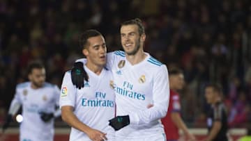 SORIA, SPAIN - JANUARY 04: Gareth Bale of Real Madrid celebrates with Lucas Vazquez after scoring his team's opening goal from the penalty spot during the Copa del Rey match between Numancia and Real Madrid at Nuevo Estadio Los Pajarito on January 4, 2018 in Soria, Spain. (Photo by Denis Doyle/Getty Images)