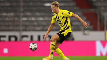 MUNICH, GERMANY - SEPTEMBER 30: Erling Haaland of Dortmund runs with the ball during the Supercup 2020 match between FC Bayern München and Borussia Dortmund at Allianz Arena on September 30, 2020 in Munich, Germany. (Photo by Alexander Hassenstein/Getty Images )