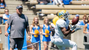 LOS ANGELES, CA - APRIL 21: UCLA's Demetric Felton, right, catches a pass as head coach Chip Kelly watches during the UCLA white vs blue Spring Showcase on Saturday, April 21, 2018 at Drake Stadium in Los Angeles, California. (Photo by Kyusung Gong/Icon Sportswire via Getty Images)