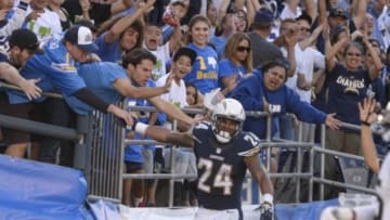 Nov 23, 2014; San Diego, CA, USA; San Diego Chargers running back Ryan Mathews (24) celebrates his second half touchdown against the St. Louis Rams with fans at Qualcomm Stadium. Mandatory Credit: Robert Hanashiro-USA TODAY Sports