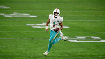 LAS VEGAS, NEVADA - DECEMBER 26: Tua Tagovailoa #1 of the Miami Dolphins scrambles for a first down during the first half against the Las Vegas Raiders at Allegiant Stadium on December 26, 2020 in Las Vegas, Nevada. (Photo by Harry How/Getty Images)