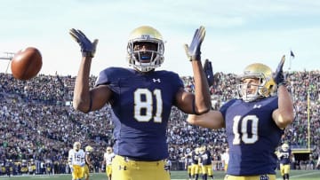 SOUTH BEND, IN - OCTOBER 13: Miles Boykin #81 of the Notre Dame Fighting Irish reacts with Chris Finke #10 after scoring the touchdown to take the lead against the Pittsburgh Panthers in the second half at Notre Dame Stadium on October 13, 2018 in South Bend, Indiana. (Photo by Quinn Harris/Getty Images)