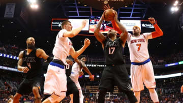 Dec 13, 2016; Phoenix, AZ, USA; Phoenix Suns forward P.J. Tucker (17) drives to the basket against New York Knicks forward Kristaps Porzingis (left) and forward Carmelo Anthony (7) in the second half at Talking Stick Resort Arena. The Suns defeated the Knicks 113-111 in overtime. Mandatory Credit: Mark J. Rebilas-USA TODAY Sports