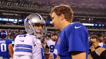 Nov 23, 2014; East Rutherford, NJ, USA; Dallas Cowboys quarterback Tony Romo (9) and New York Giants quarterback Eli Manning (10) after their game at MetLife Stadium. The Cowboys defeated the Giants 31-28. Mandatory Credit: Adam Hunger-USA TODAY Sports