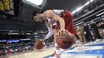 Apr 4, 2014; Arlington, TX, USA; Wisconsin Badgers forward Duje Dukan (13) executes a dribbling drill during practice before the semifinals of the Final Four in the 2014 NCAA Mens Division I Championship tournament at AT&T Stadium. Mandatory Credit: Bob Donnan-USA TODAY Sports
