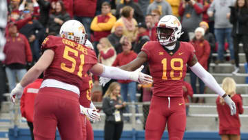 LAWRENCE, KS - NOVEMBER 3: Wide receiver Hakeem Butler #18 of the Iowa State Cyclones celebrates his touchdown with offensive lineman Julian Good-Jones #51 in the first quarter against the Kansas Jayhawks at Memorial Stadium on November 3, 2018 in Lawrence, Kansas. (Photo by Ed Zurga/Getty Images)