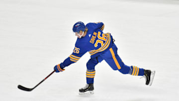 Jan 26, 2021; Buffalo, New York, USA; Buffalo Sabres defenseman Rasmus Dahlin (26) takes a shot on goal against the New York Rangers in the second period at KeyBank Center. Mandatory Credit: Mark Konezny-USA TODAY Sports