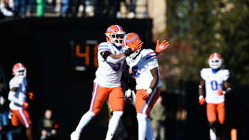 Florida Gators defensive players celebrate against Vanderbilt Commodores in Nashville, Tennessee. Getty Images.