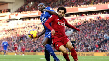 LIVERPOOL, ENGLAND - OCTOBER 27: Mohamed Salah of Liverpool is challenged by Sol Bamba of Cardiff City during the Premier League match between Liverpool FC and Cardiff City at Anfield on October 27, 2018 in Liverpool, United Kingdom. (Photo by Jan Kruger/Getty Images)