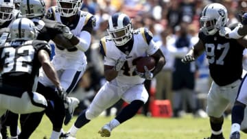 LOS ANGELES, CA - AUGUST 18: John Kelly #42 of the Los Angeles Rams runs the ball during the second half of a preseason game against the Oakland Raiders at Los Angeles Memorial Coliseum on August 18, 2018 in Los Angeles, California. (Photo by Sean M. Haffey/Getty Images)