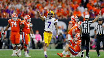 NEW ORLEANS, LOUISIANA - JANUARY 13: Grant Delpit #7 of the LSU Tigers reacts after sacking Trevor Lawrence #16 of the Clemson Tigers during the first quarter in the College Football Playoff National Championship game at Mercedes Benz Superdome on January 13, 2020 in New Orleans, Louisiana. (Photo by Jonathan Bachman/Getty Images)