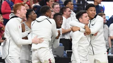 LAS VEGAS, NV - MARCH 10: Players on the Arizona Wildcats bench react after a dunk by teammate Rawle Alkins