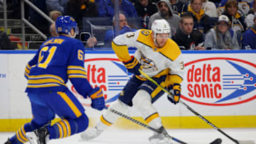 Mar 21, 2023; Buffalo, New York, USA; Nashville Predators defenseman Jeremy Lauzon (3) looks to take a shot on goal as Buffalo Sabres defenseman Riley Stillman (61) defends during the first period at KeyBank Center. Mandatory Credit: Timothy T. Ludwig-USA TODAY Sports