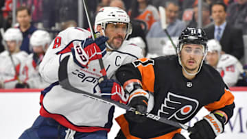Dec 7, 2022; Philadelphia, Pennsylvania, USA; Washington Capitals left wing Alex Ovechkin (8) and Philadelphia Flyers right wing Travis Konecny (11) battle during the third period at Wells Fargo Center. Mandatory Credit: Eric Hartline-USA TODAY Sports