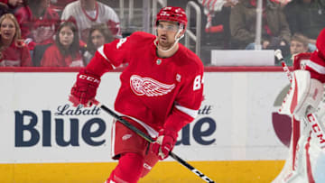 DETROIT, MI - MARCH 29: Jake Chelios #84 of the Detroit Red Wings skates up ice in his first career NHL game during an NHL game against the New Jersey Devils at Little Caesars Arena on March 29, 2019 in Detroit, Michigan. (Photo by Dave Reginek/NHLI via Getty Images)