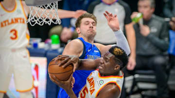 Feb 10, 2021; Dallas, Texas, USA; Dallas Mavericks guard Luka Doncic (77) blocks a shot by Atlanta Hawks center Clint Capela (15) during the first quarter at the American Airlines Center. Mandatory Credit: Jerome Miron-USA TODAY Sports