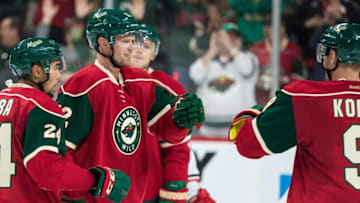 Oct 2, 2016; Saint Paul, MN, USA; Minnesota Wild forward Eric Staal (12) celebrates his goal with teammates during the third period of a preseason hockey game against the Carolina Hurricanes at Xcel Energy Center. The Wild defeated the Hurricanes 3-1. Mandatory Credit: Brace Hemmelgarn-USA TODAY Sports