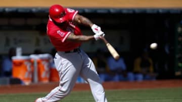 Sep 24, 2014; Oakland, CA, USA; Los Angeles Angels second baseman Howie Kendrick (47) hits an RBI single against the Oakland Athletics during the first inning at O.co Coliseum. Mandatory Credit: Kelley L Cox-USA TODAY Sports